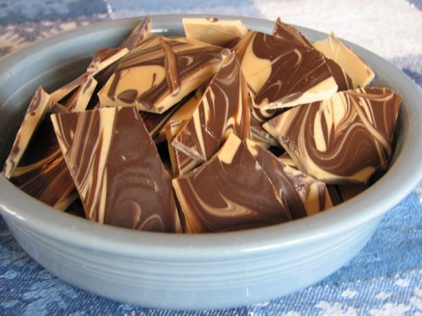Tiger Bark 1 pound white chocolate, cut into pieces or use white chocolate chips 1/2 cup Peanut Butter 1/2 cup semisweet chocolate chips 4 teaspoons half-and-half or whipping cream In a