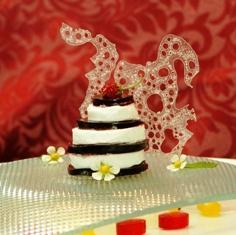 00 9 Cake (serves 10) Three inch individual plated serving with Fruit Coulis and garnish