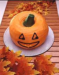 Sweets & Goodies Recipes: Jack-O'-Lantern Cake Serves: 36 2 (10-inch) Bundt cakes Buttercream Frosting (recipe) Orange, green and brown paste food colorings Base Frosting (recipe follows, optional)