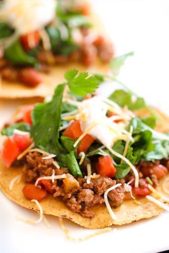 DAY 3 SMALLER FAMILY - GROUND BEEF TOSTADAS M A I N D I S H Serves: 3-4 Prep Time: 5 Minutes Cook Time: 10 Minutes 3/4 pound lean ground beef 3/4 (15 ounce) can pinto beans (drained and rinsed) 3/4