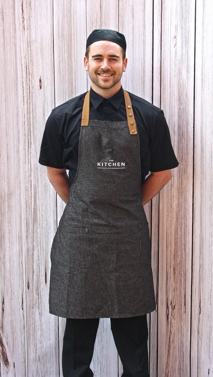 Uniform Design Sites Consisting of embroidered denim style aprons with leather straps to