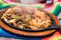 of the finest quality marinated chicken breast, meat and seafood and cook it to perfection on our open flame grill, to create the perfect fajita that we bring to your table in a sizzling skillet.