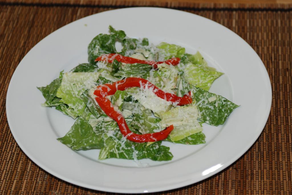Mexican Caesar Salad Yield: 6 to 8 Servings For cilantro pepita dressing: 1 medium Anaheim chilies -- roasted, peeled and seeded 2 Tablespoons roasted pepitas 1 garlic cloves -- diced 1/4 teaspoon