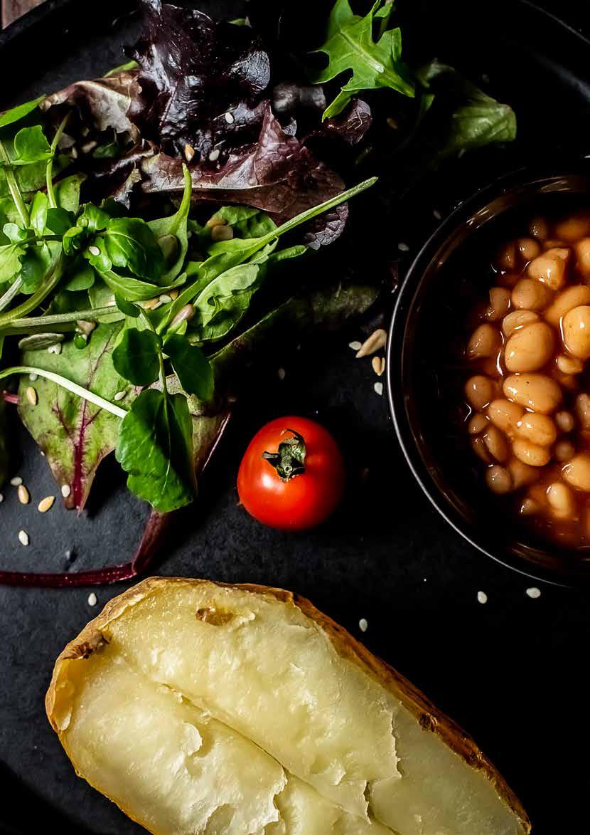 LUNCH 1 large potato (unpeeled) 210g / 1 cup baked beans 150g / 1 cup mixed salad 1 tbsp extra virgin olive oil 1 tsp linseed oil 3 tbsp mixed seeds 1 slice wholemeal bread for mopping 1.