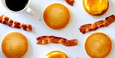 Crack the eggs into the bottom of the Breakfast Sandwich Maker. Add the seasoning and whisk to combine. Add the bacon to the deep insert and microwave for 1 minute. 2.