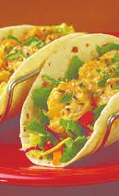 $4 KICKIN SHRIMP TACOS Lightly breaded crispy shrimp tossed in housemade kickin sauce and topped with Cheddar and mozzarella cheese.