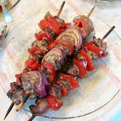 Souvlaki Servings: 12 Yield: 12 servings Cook: 15 minutes Preparation Time: 30 minutes 1 lemon, juiced 1/4 cup olive oil 1/4 cup soy sauce 1 teaspoon dried oregano 3 cloves garlic, crushed 4 pounds