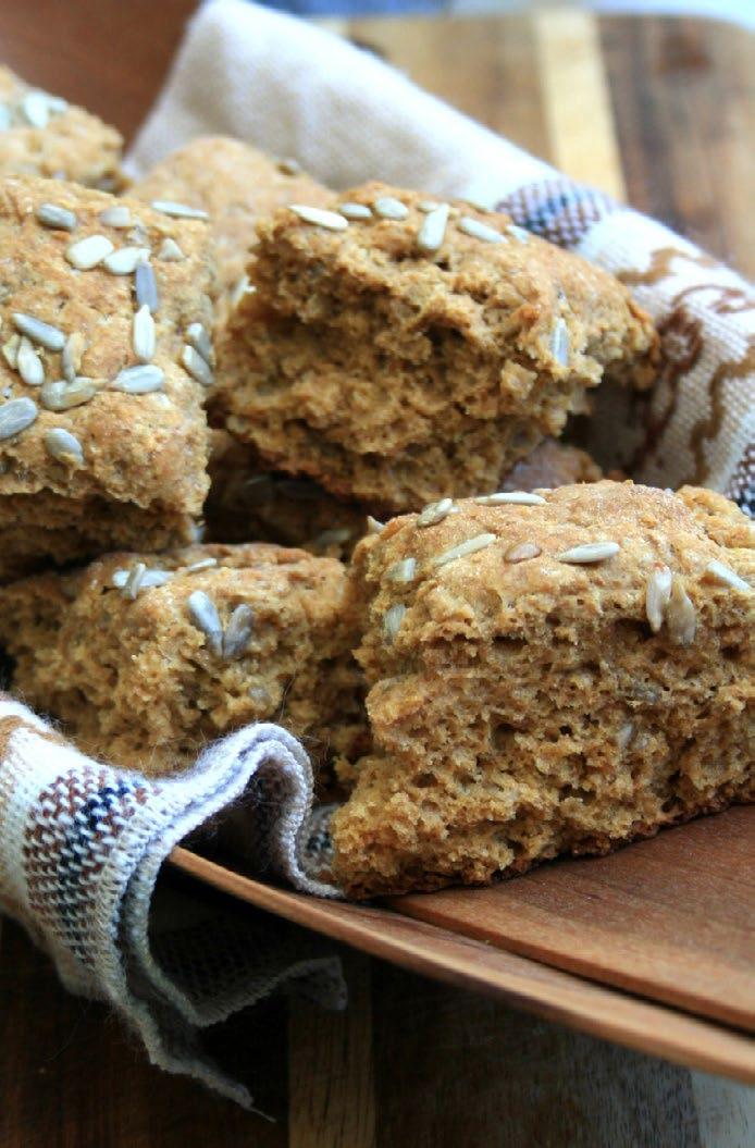 Molasses Scones Makes 18 scones 1 ¾ cups flour 1 cup whole wheat flour ½ cup toasted sunflower seeds, plus more for sprinkling 2 ½ tsp baking powder ½ tsp baking soda ½ tsp salt ½ cup cold butter,