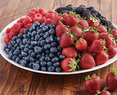 We pick the finest blackberries, blueberries, raspberries and strawberries to pile on this tray.