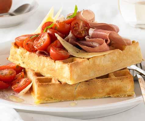 Zucchini, prosciutto and parmesan SERVES 12 waffles PREP 30 COOK 40 Ingredients 1 small onion, finely grated 1 zucchini, grated 3 cups plain flour 3 teaspoons baking powder 1 teaspoon sea salt ½ cup