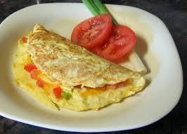 Make omelets by slightly beating eggs, and