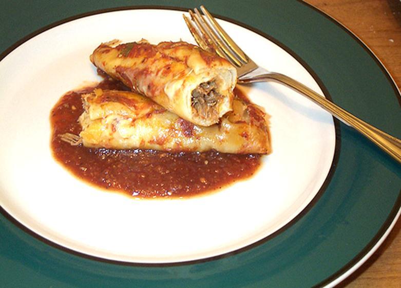 Enchilada (en chi la da) or (en-chə- lä-də) Traditional Mexican dish where