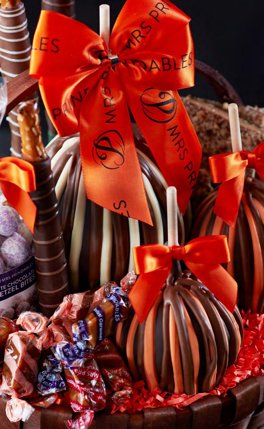 Classic Halloween Caramel Apple Gift Basket A basket filled with fall classics.