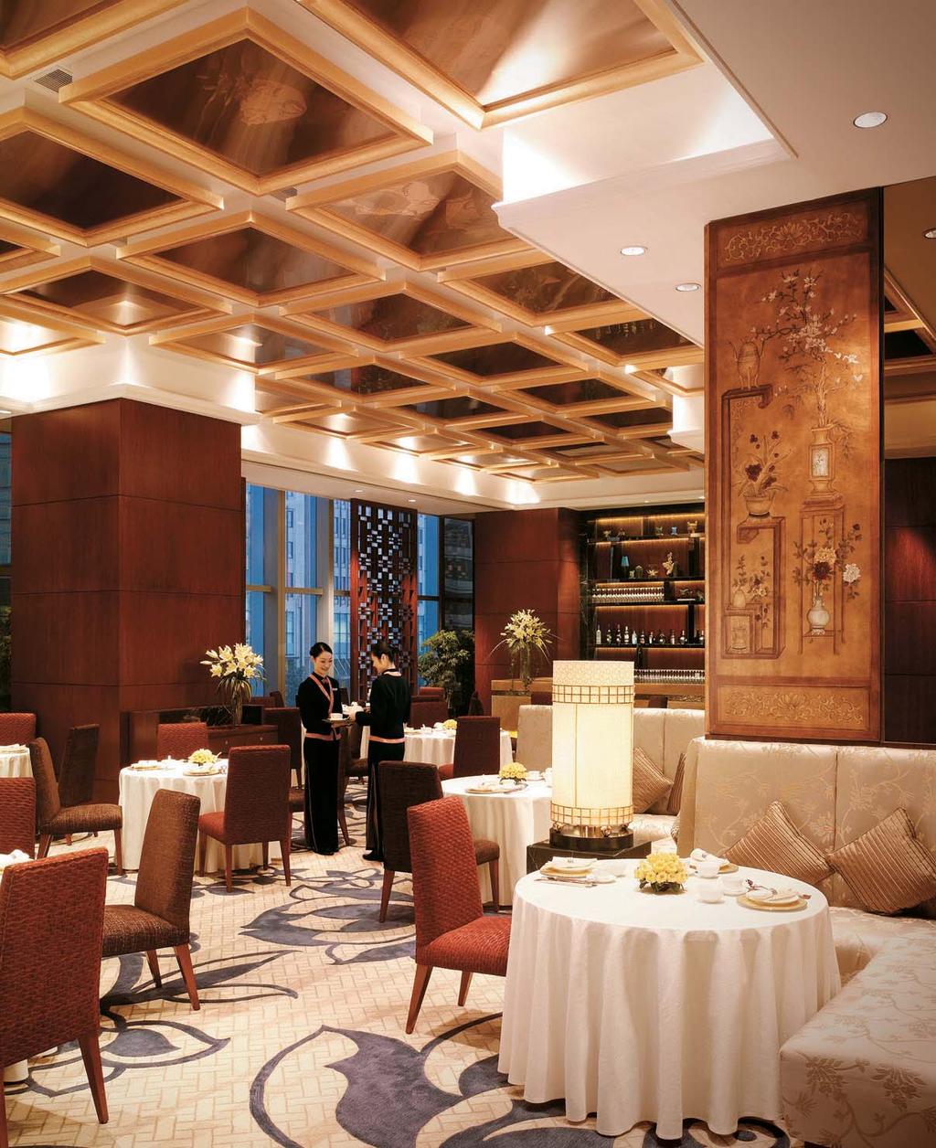 in the cosiness of fook lam moon s private dining room, the golden glow from the chandeliers above softened our faces.