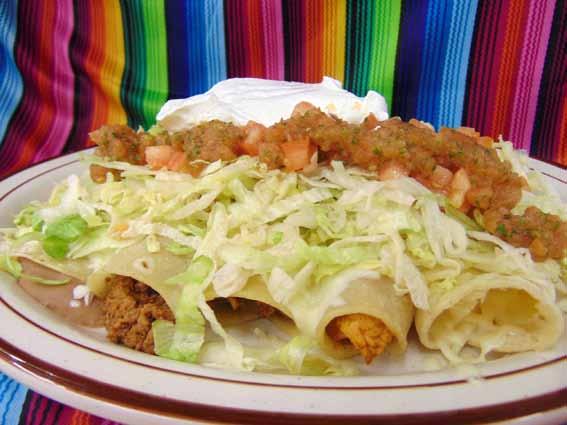 99 Super Enchiladas Five enchiladas: one chicken, one beef, one stew steak, one bean and one cheese topped with lettuce, sour cream and tomatoes 10.