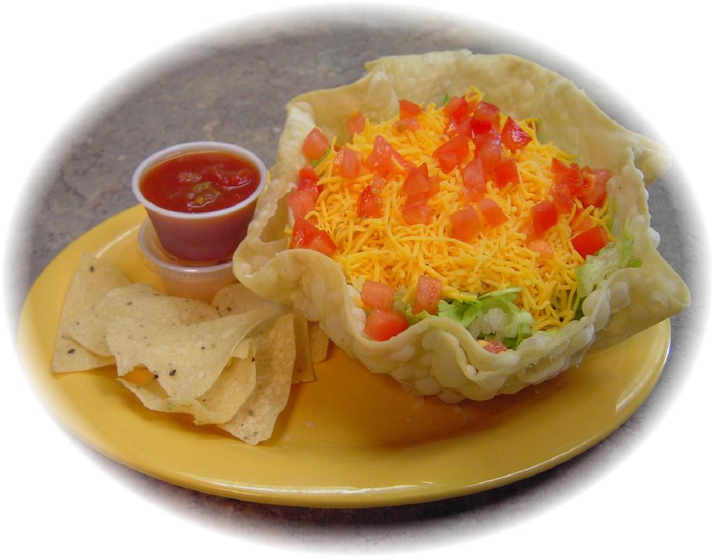 TACO SALAD Fried tortilla bowl filled with crisp lettuce, your choice of meat, topped with shredded cheese, diced tomatoes, black olives, onions SOFT SHELL Soft flour tortilla filled with your choice
