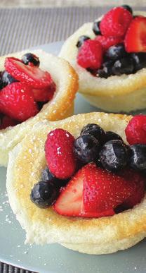 ANGEL CAKES WITH SUGARED BERRIES Prep time: 30 minutes Total time: 35 minutes 1 box Angel Food Cake mix 2 cups blueberries 2 cups sliced strawberries 1 cup raspberries ½ cup raw sugar ¼ teaspoon