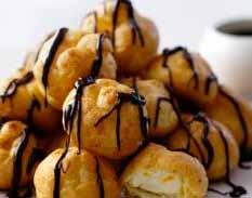 Cream Filled Profiteroles* Fresh Cream Filled Choux Pastry Drizzled with Belgian Chocolate.