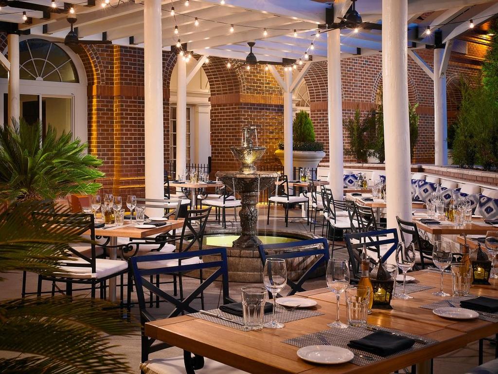 A T Ariccia Trattoria Patio Guests will feel like they are dining in a secret garden due to the hedges surrounding the space.