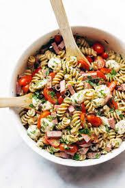 Ingredients: 1 (16 Ounce) package fusilli (spiral) pasta 3 cups cherry tomatoes, halved ½ pound provolone cheese, cubed ½ pound salami, cubed ¼ pound sliced pepperoni, cut in half 1 large green bell