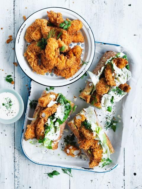 Crispy deep fried prawn baguette with a fennel and buttermilk slaw 24 medium green Australian prawns, peeled and tails left intact 2 cups of buttermilk 1 litre vegetable oil, for deep frying 3 small