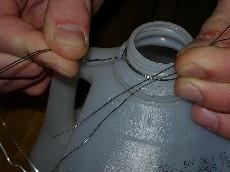 Using scissors, cut one side and the top off your milk jug or soda bottle. Leave a 1 1/2 inch bottom. 2.