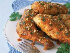 Chicken with Peanut Mole Sauce 4 lbs. chicken thighs or breasts (skinned) 4 c. water 1 med. carrot 3 stalks celery 1 sm. onion Dash pepper 3 slices bread (white) 4 tbsp. peanut butter 3/4 tsp.