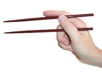4. Keep the first chopstick stationary as you practice moving the second chopstick toward the stationary one.