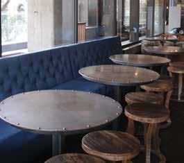 couches. It features cinema chairs and tables lining the Swanston Street side of the bar.