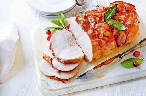 38 A juicy turkey breast stuffed with pork, sage and onion, and covered with a bacon lattice. Ready to cook in a foil tray. Serves 8-10 1.78kg 00770972 C Butter-basted turkey breast 30.