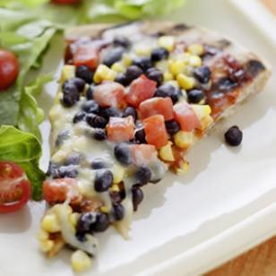 Corn & Black Bean Pizza 1 cup tomato, diced 1 (15 ounce) can black beans, rinsed 1 cup corn kernels 1 cup bell pepper, diced 1/4 cup green onion, chopped 12 inch prepared whole-wheat pizza crust 1/3