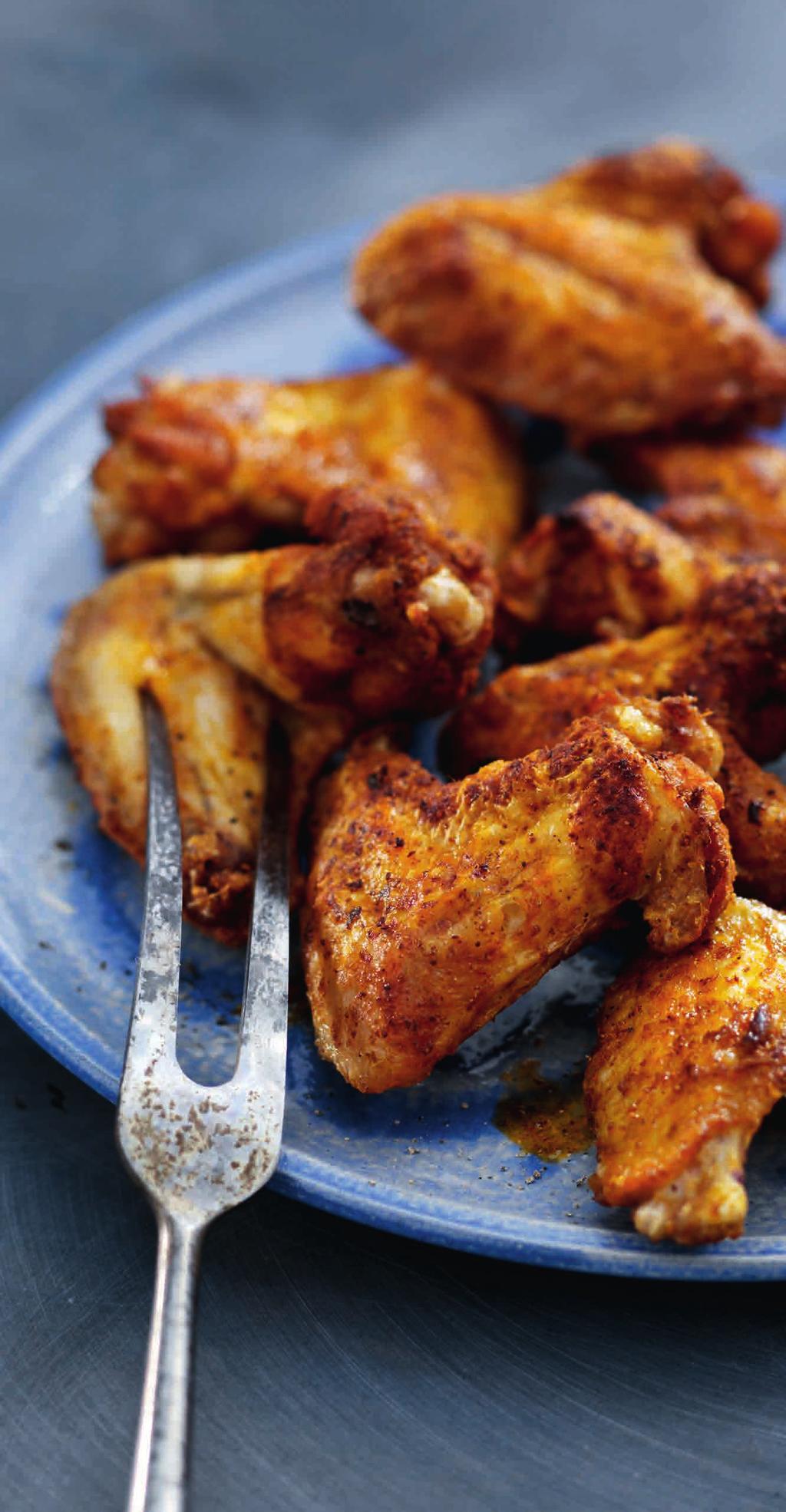 Roasted Asian Chicken Wings Main course - 4 portions 5 minutes + 10 minutes airfryer 2 cloves garlic 2 teaspoons ginger powder 1 teaspoon ground cumin 500 g chicken wings at room temperature 100 ml