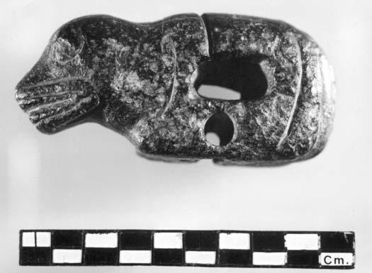 Sandstone atlatl weight with lizard-like design from Mission area on lower Fraser River. DR-Y, private collection (L l.9 cm, W 4.5 cm, H.7 cm). RBCM photo PN20427.