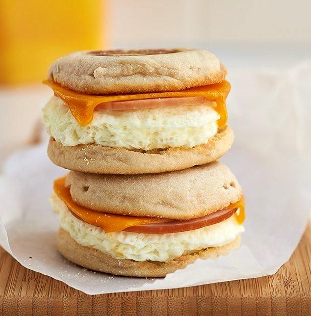 Breakfast Sandwich 2 English muffins ¾ cup liquid egg whites 2 slices desired cheese 2 pieces desired breakfast meat (Canadian bacon, sausage, bacon) 1.