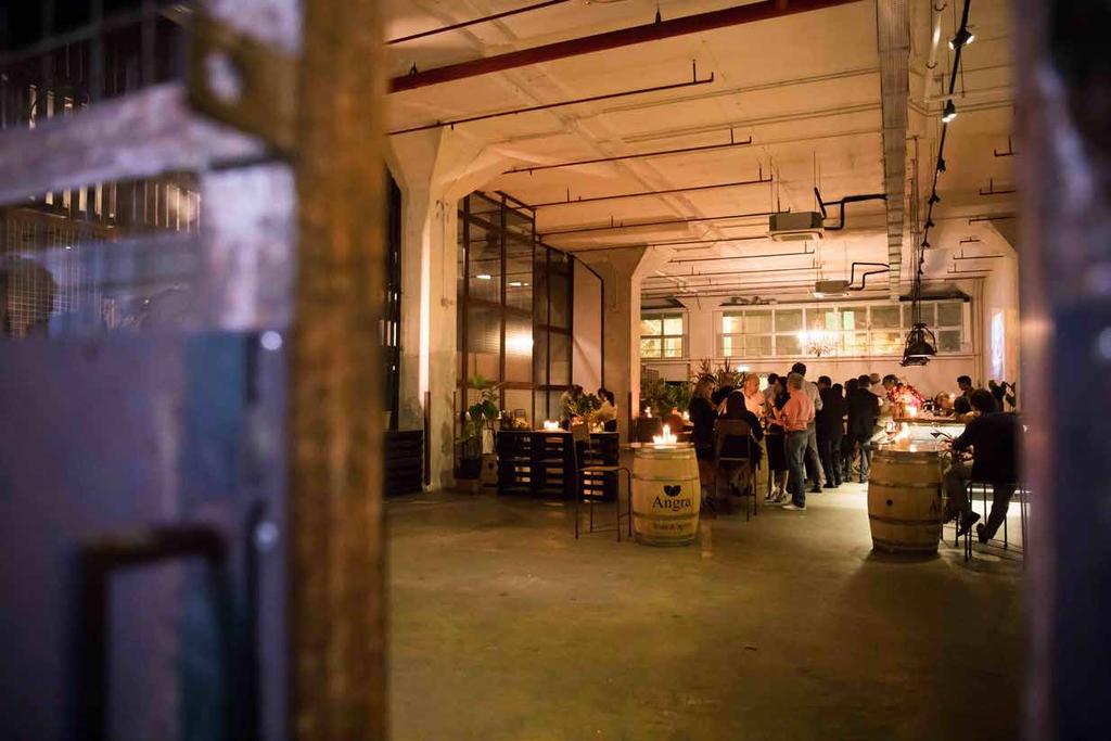 A CUTTING EDGE EVENT SPACE IN THE HEART OF SINGAPORE Filled with interesting elements like exposed concrete walls and ductwork, industrial lighting, sea views and urban artwork, the warehouse style