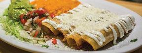 95 CARNITAS BURRITO A large flour tortilla filled with refried beans, carnitas and topped with cheese and red tomato sauce...9.95 CHIMICHANGA A fried, crispy flour tortilla filled with your choice of shredded beef, chicken or carnitas and topped with our special cheese sauce.