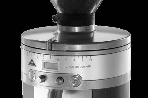 6.1.1 Actuate the main switch on the rear of the grinder (pos. 19). 6.1.2 Open the hopper. Pour whole roasted espresso beans into the hopper from above. Never pour in coffee powder. Close the hopper.