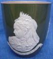 8 inch beaker with white pattern on green stoneware. Manufactured at Spode Works in Stoke, 1076. Latest insurance valuation (11/01/2005) 175. Barrel shape.