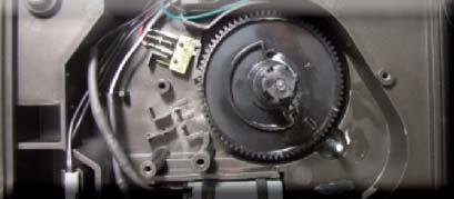 Loosen the screws as illustrated and remove the gearmotor cover.