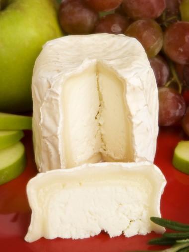 Monocacy Silver Mini #6309 2oz wheel Cherry Glen Goat Cheese Company, Maryland Soft-ripened cylindrical shaped cheese with a white mold exterior.