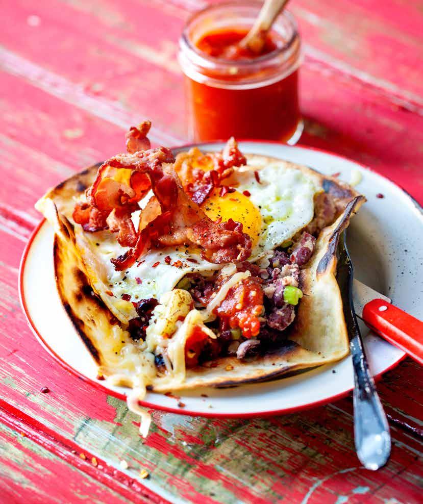 OPEN BREAKFAST TORTILLA WITH FRIED EGGS, SPICED GRILLED TOMATOES, SALSA AND BAKED BEANS Topped with bacon 2
