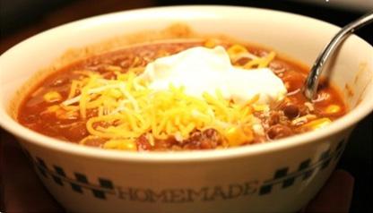 Taco Soup 1 pound ground beef- cooked and drained 1 onion (chopped) 2 15 oz. cans chili beans 1 15 oz. can corn 1 15 oz. can tomato sauce 1 10 oz.