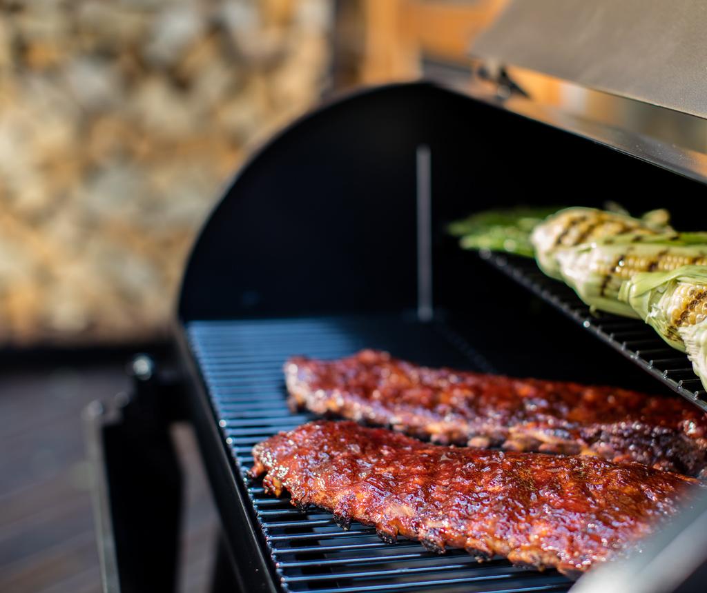 Wood Fired Grills Renegade Pro USE & CARE INSTRUCTIONS A MAJOR CAUSE OF FIRES IS FAILURE TO MAINTAIN REQUIRED CLEARANCES (AIR SPACES) TO COMBUSTIBLE MATERIALS.