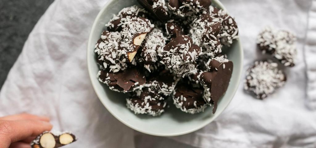 15 MINUTES Dark Organic Chocolate (at least 70% cacao, chopped) Coconut Oil Almonds Unsweetened Shredded Coconut Microwave dark chocolate and the coconut oil in a large glass bowl at 50% power for 30