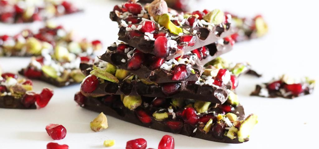 30 MINUTES Dark Organic Chocolate (at least 70% cacao) Pomegranate Seeds Pistachios (shelled and chopped) Unsweetened Coconut Flakes Line a large baking sheet with parchment paper.