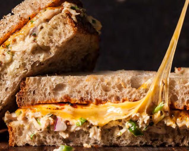 Chipotle Tuna Melt 36 4 slices of bread ¼ cup of mayonnaise 1 small can chipotle pepper in adobo sauce 1 small can of tuna 2 slices of American cheese Salt & pepper Butter Using a food processor,