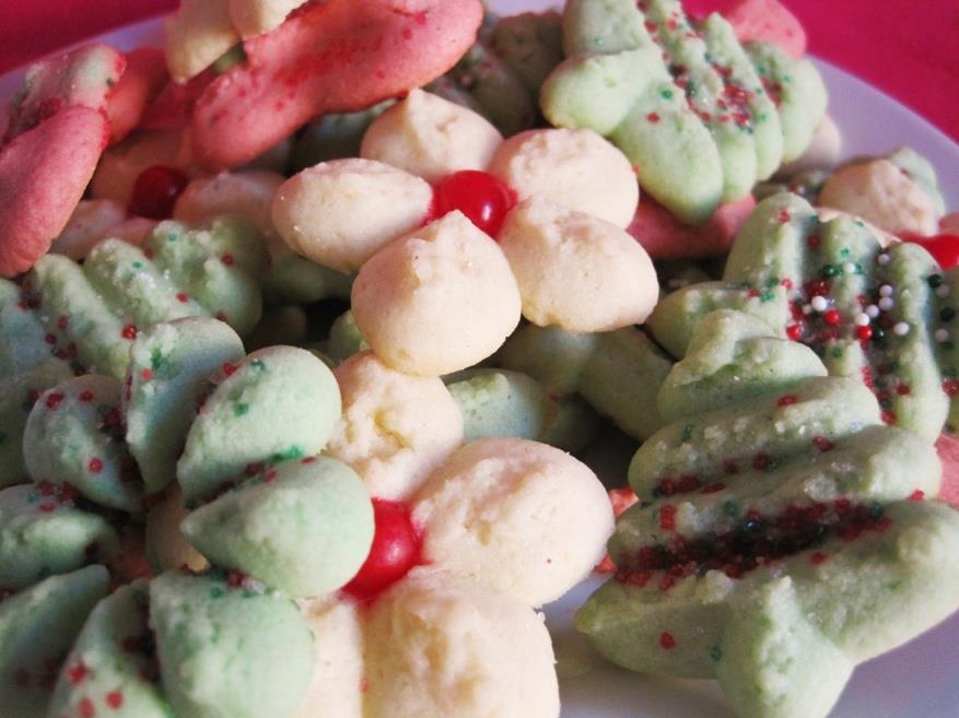 1 ½ cups butter 1 cup sugar 1 teaspoon baking powder 1 egg 1 teaspoon vanilla 3 ½ cups flour Green and/or red food coloring paste Spritz Cookies Makes 7 dozen cookies 375 F NOTE: Paste is available