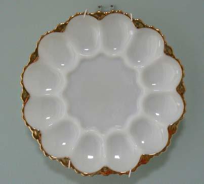 An opaque glass oyster plate with