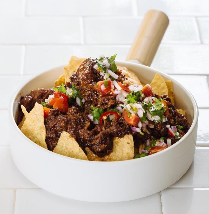 Corn Chips with braised oxtail with coriander salsa This jammy, gelatinous oxtail is a wonderful topping for corn chips.