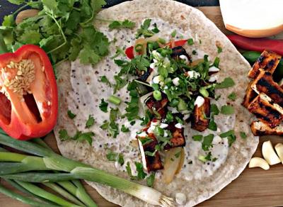 Philly Wrap Serves: 4 300g Firm Tofu, pressed 1½ tbsp Olive Oil 100g BBQ Sauce ½ large Red Pepper, sliced ½ large Onion, sliced 1 Green Chilli, finely sliced 2 Garlic Cloves, finely diced 100g Soya
